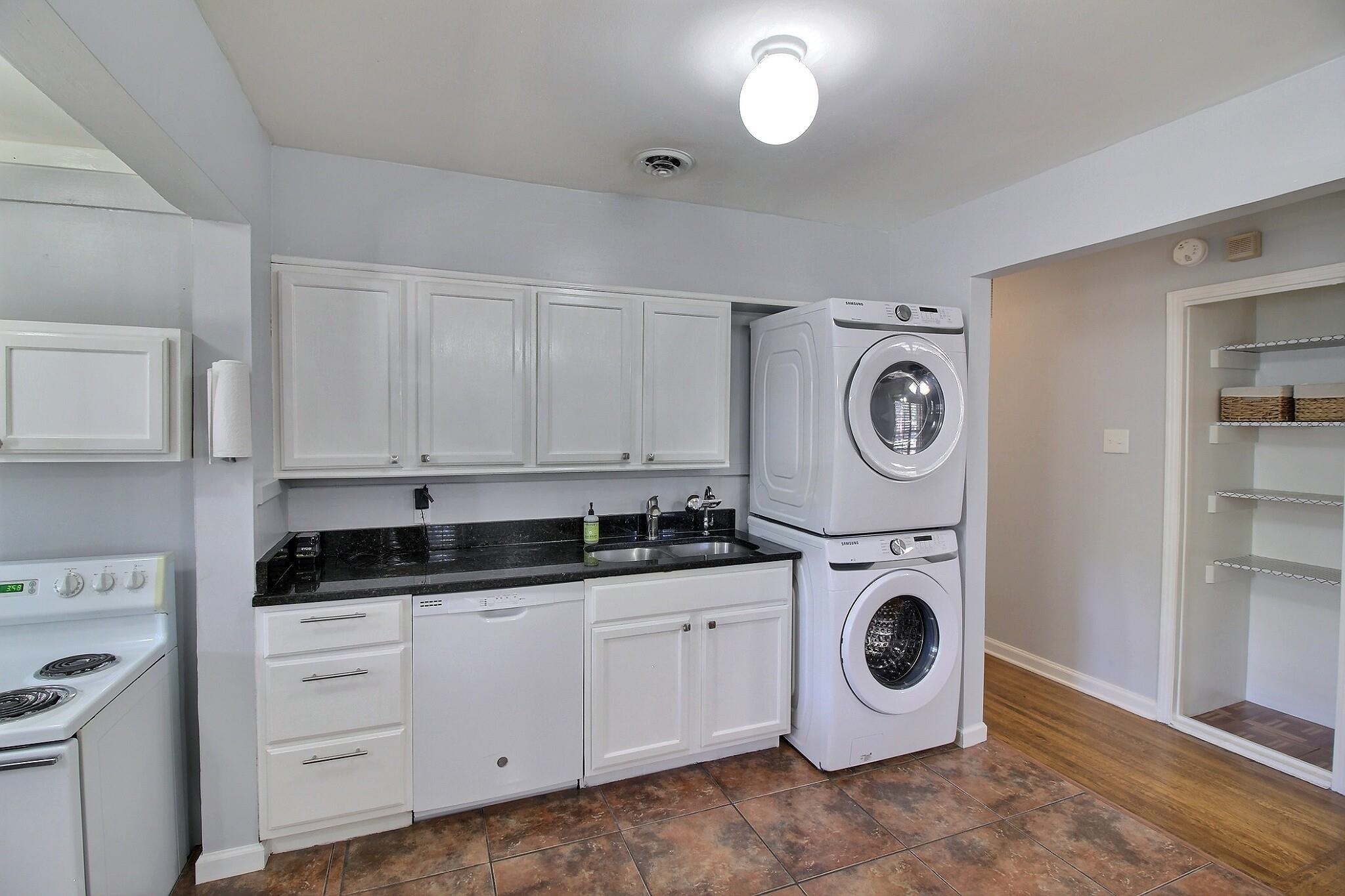 4528 Quince Road Memphis, TN 38117 - Photo 7 of 27 a kitchen with cabinets and white appliances