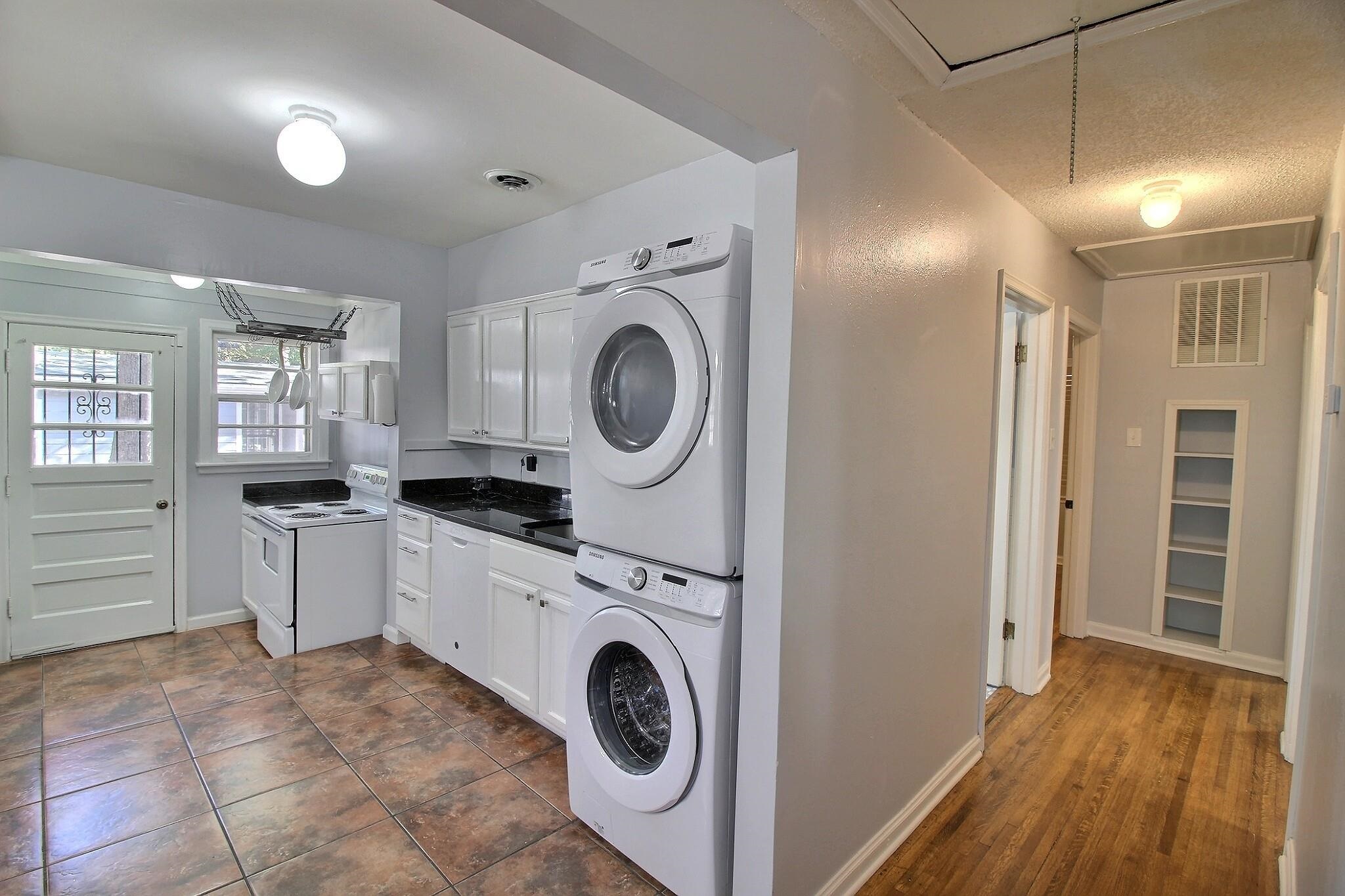 4528 Quince Road Memphis, TN 38117 - Photo 8 of 27 a view of a kitchen with a sink a washer and dryer