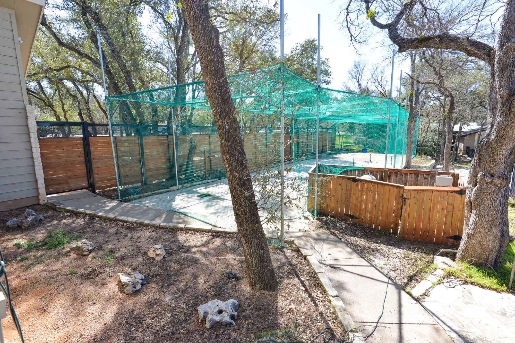 10710 D-K Ranch Road Austin, TX 78759 - Photo 33 of 34 Secure, fenced outdoor enclosure offers versatile space for recreation or pets.