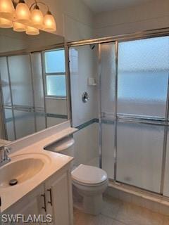 1430 Delbrook Way Marco Island, FL 34145 - Photo 14 of 18 a bathroom with a sink toilet and shower