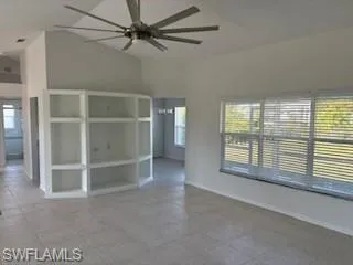 an empty room with a empty space and windows