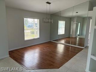 1430 Delbrook Way Marco Island, FL 34145 - Photo 4 of 18 an empty room with wooden floor and windows