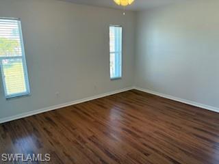 1430 Delbrook Way Marco Island, FL 34145 - Photo 8 of 18 an empty room with wooden floor and windows