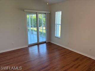 1430 Delbrook Way Marco Island, FL 34145 - Photo 9 of 18 a view of an empty room with wooden floor and a window