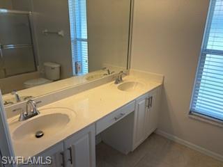 1430 Delbrook Way Marco Island, FL 34145 - Photo 10 of 18 a bathroom with a sink and a mirror
