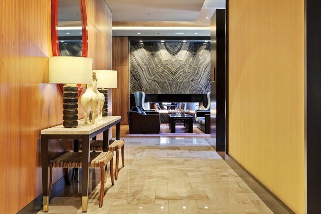 a living room with a table and chairs