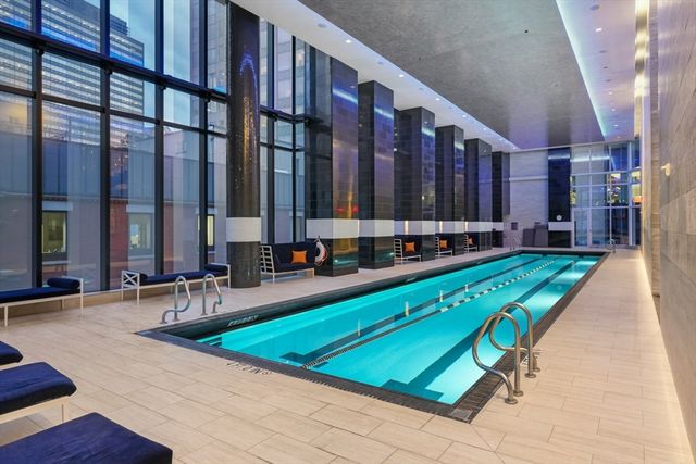 a large building with pool table and chairs