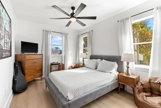 a bedroom with a bed and a tv