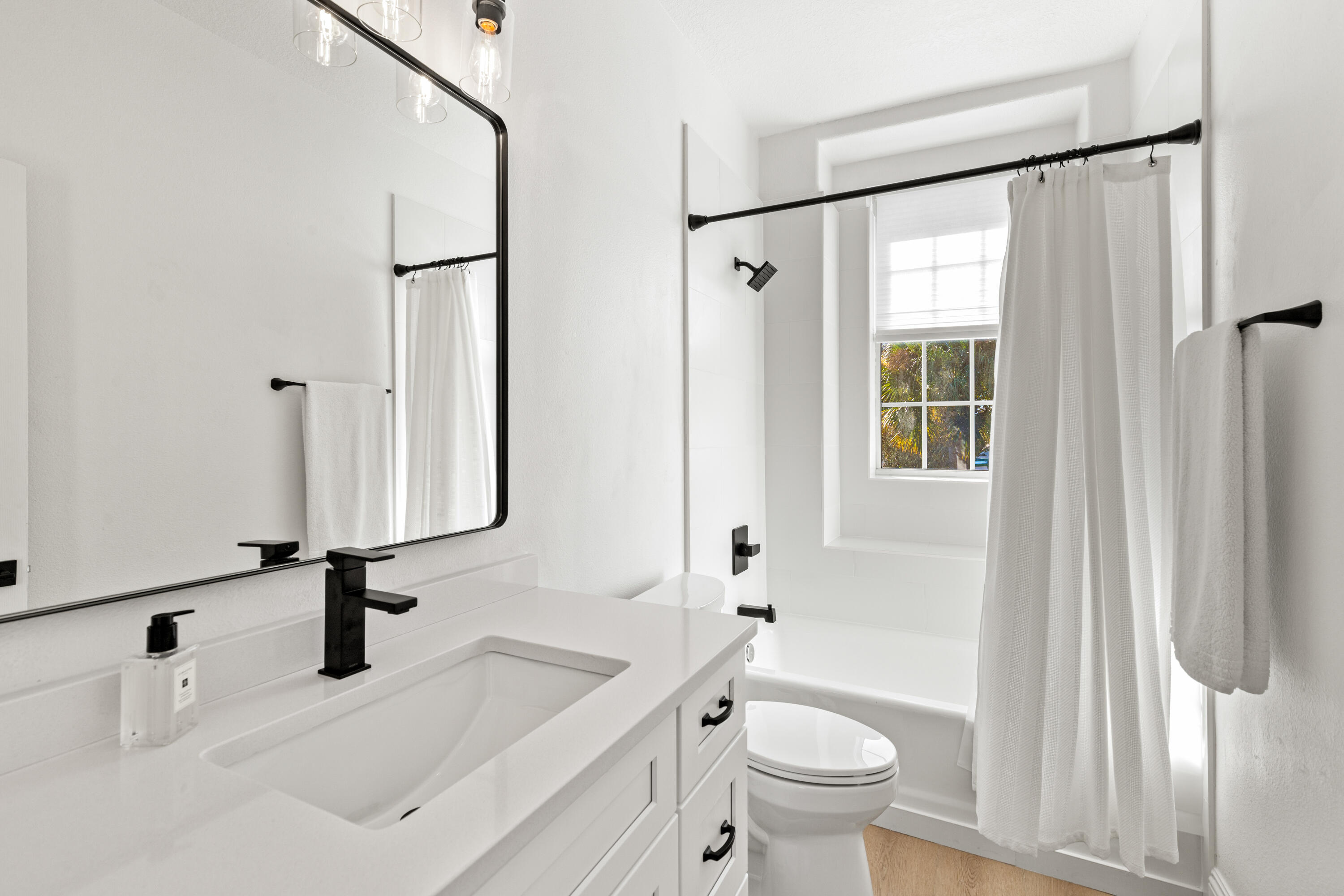 4591 Sailmaker Lane Destin, FL 32541 - Photo 21 of 41 a bathroom with a sink toilet and shower