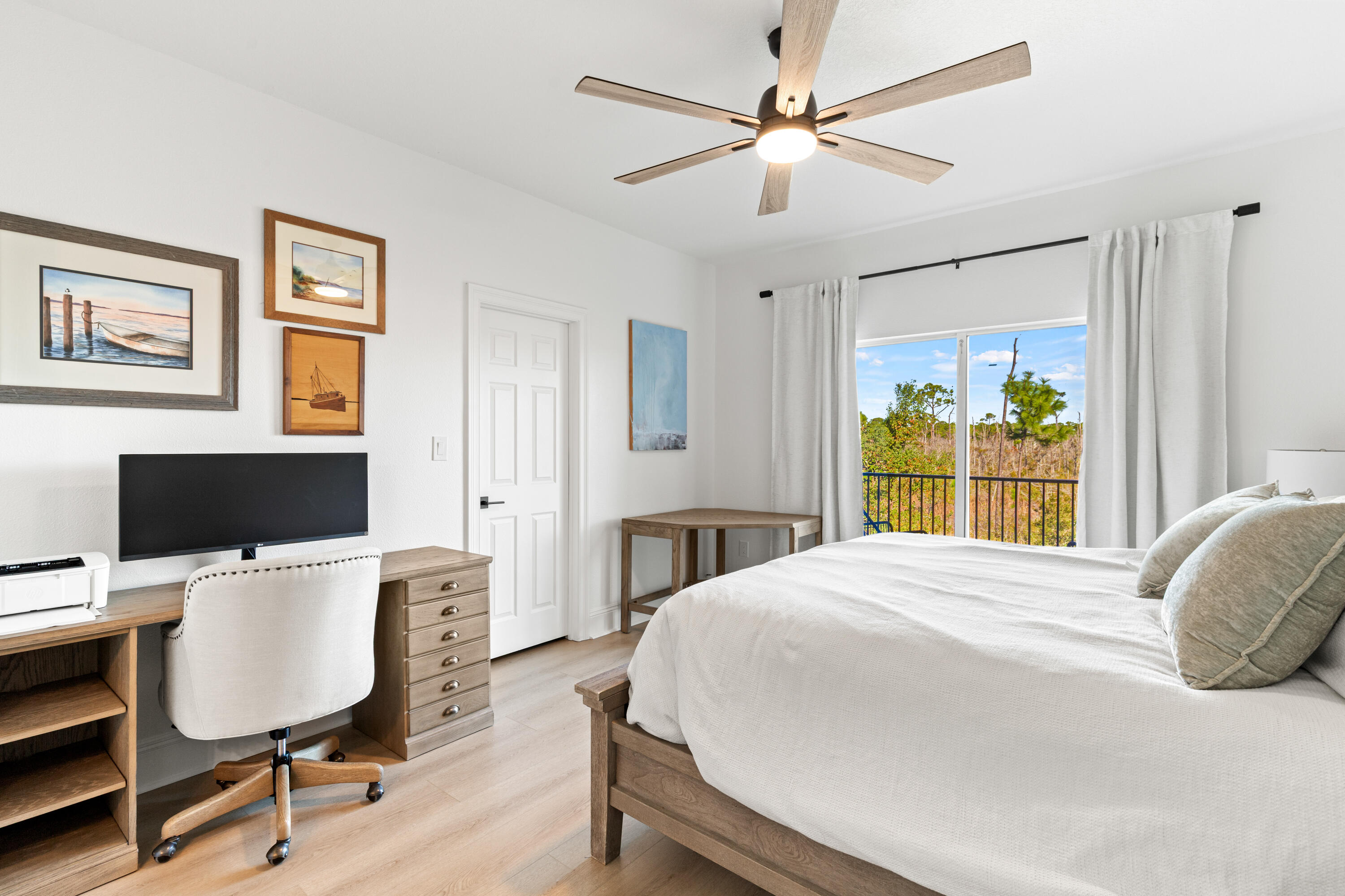 4591 Sailmaker Lane Destin, FL 32541 - Photo 22 of 41 a bedroom with a bed a computer on a desk and chair