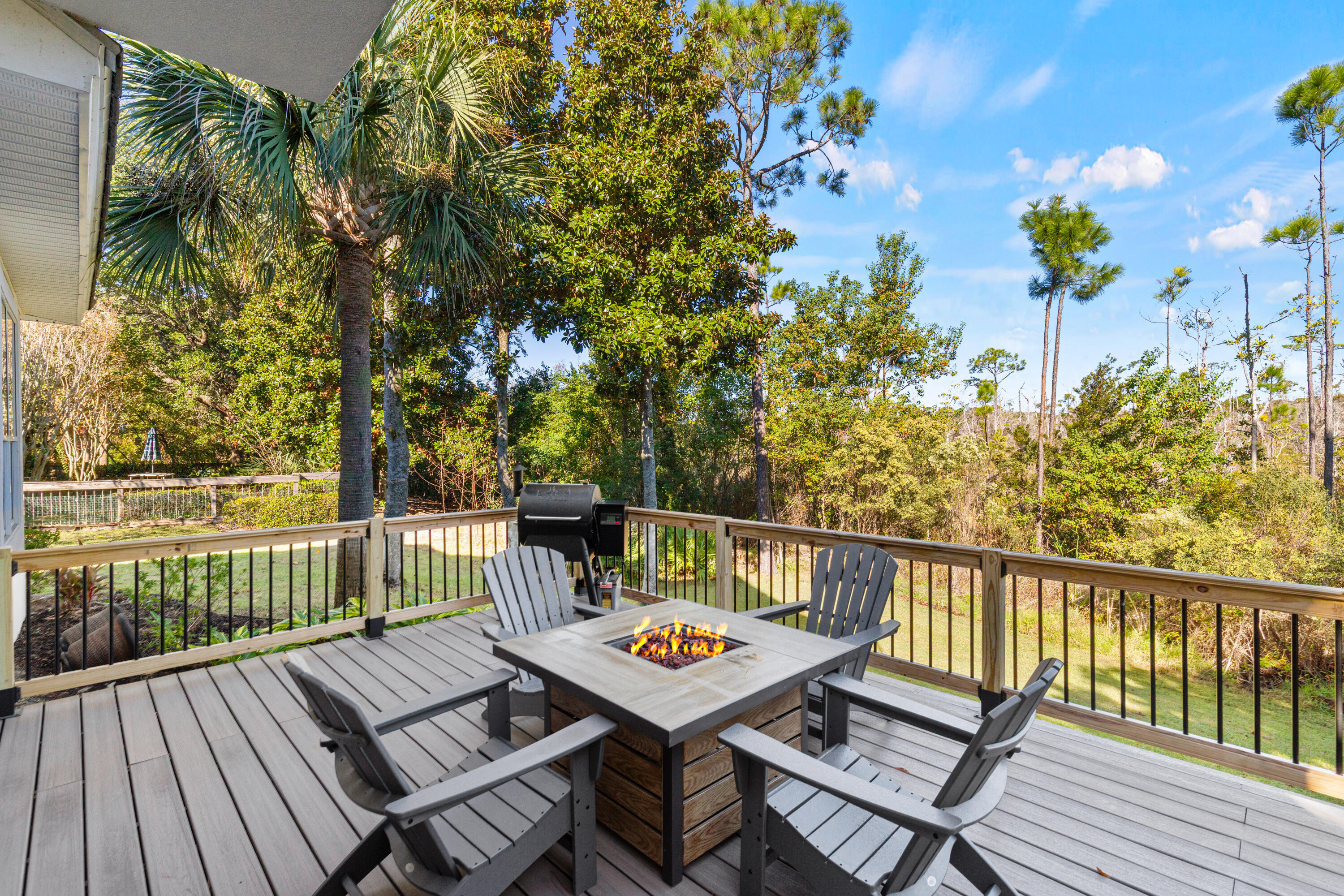 4591 Sailmaker Lane Destin, FL 32541 - Photo 31 of 41 a view of a balcony with wooden floor and outdoor seating