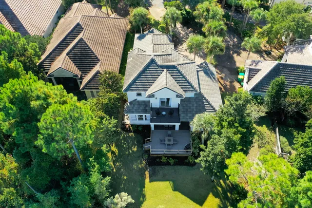 an aerial view of house with yard swimming pool and outdoor seating