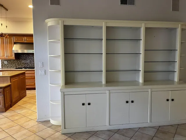 a view of cabinets with white cabinets