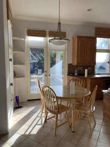 a dining room with furniture and window