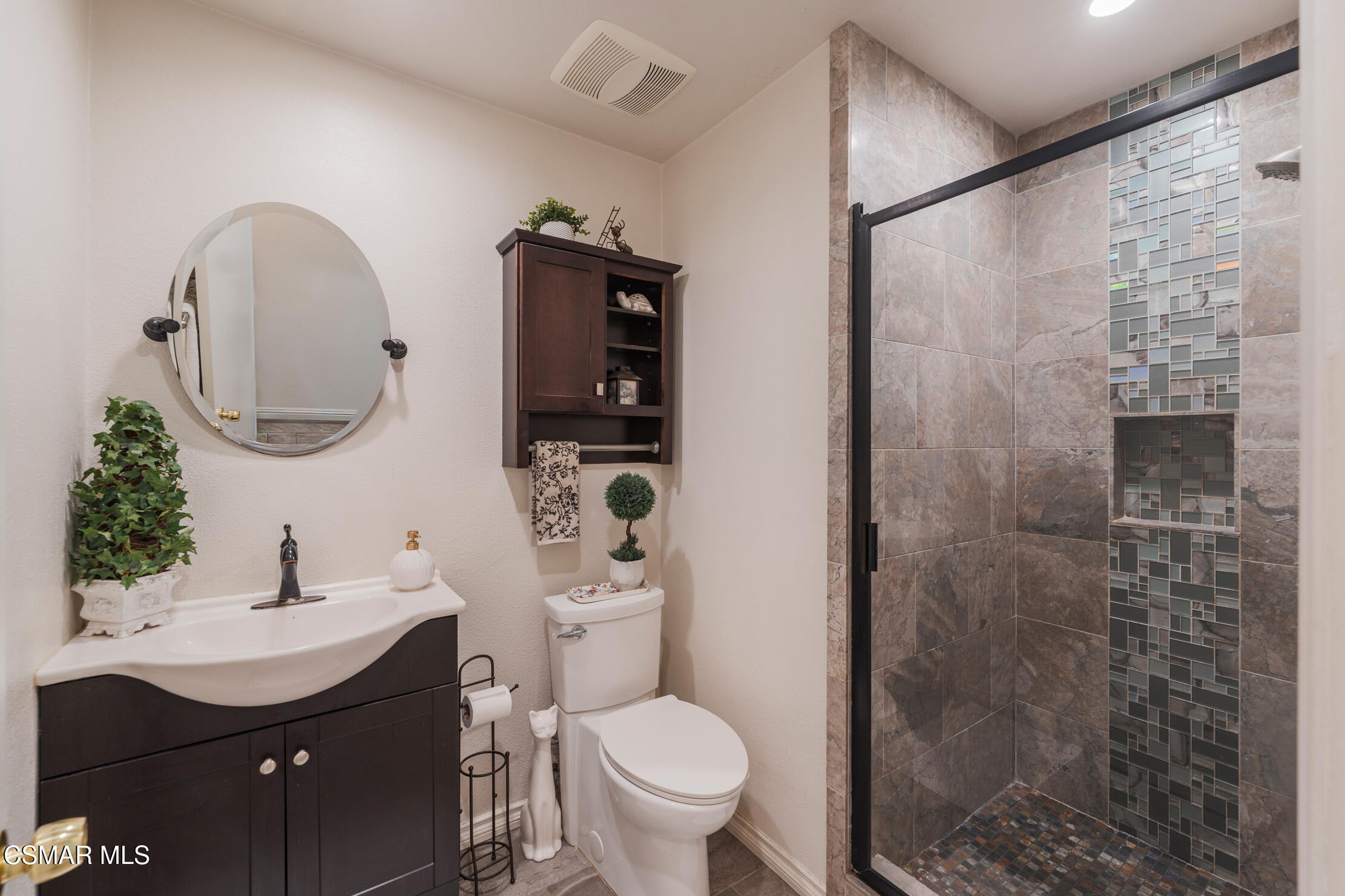1917 Fitzgerald Road Simi Valley, CA 93065 - Photo 18 of 55 a bathroom with a sink toilet and shower