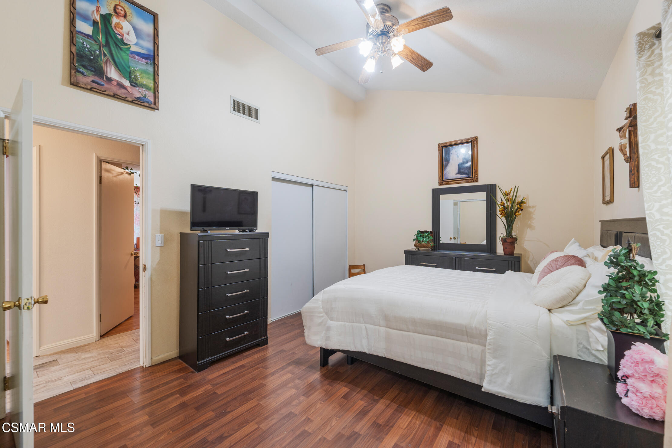 1917 Fitzgerald Road Simi Valley, CA 93065 - Photo 19 of 55 a bedroom with a bed and a chandelier