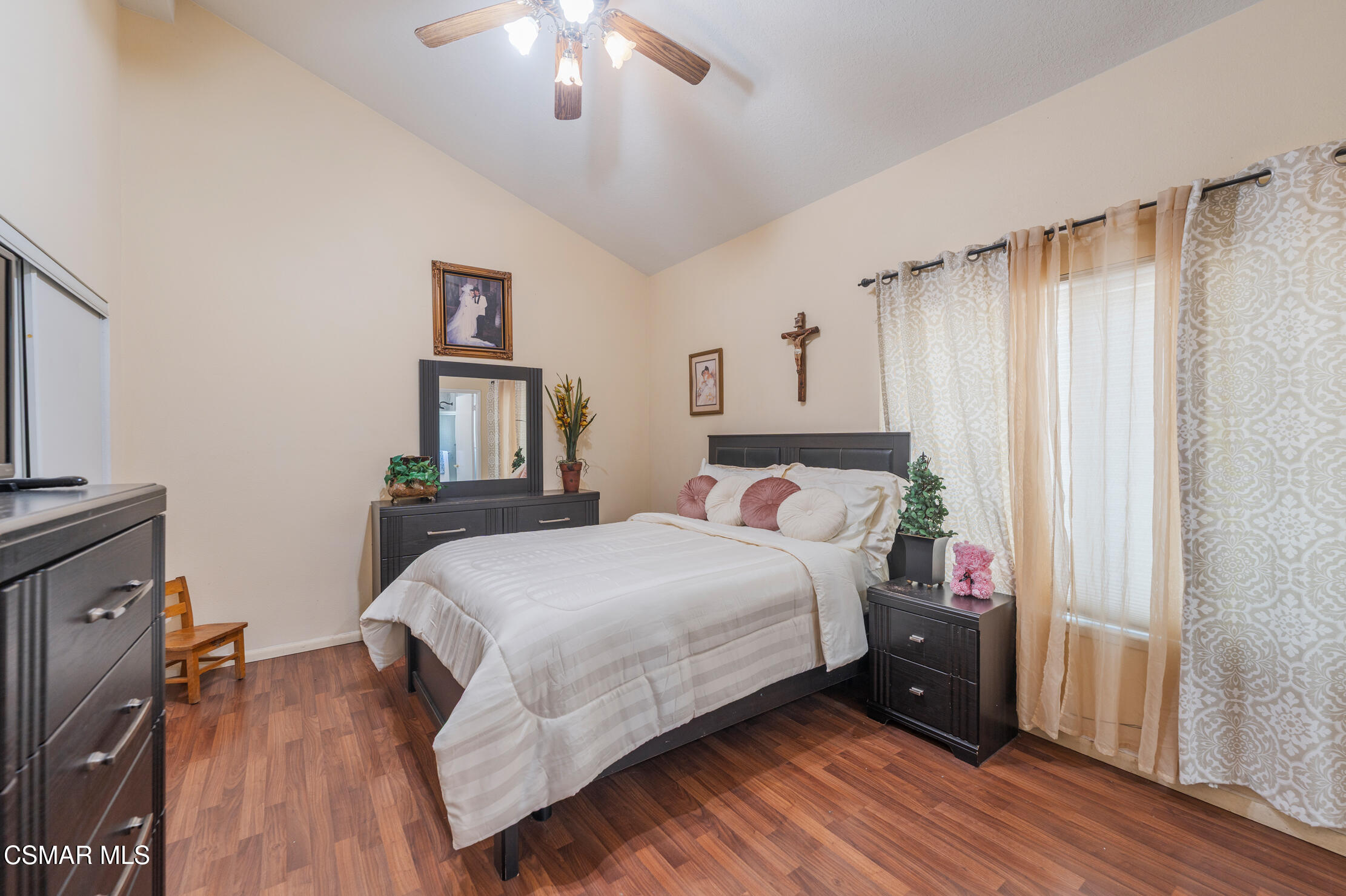 1917 Fitzgerald Road Simi Valley, CA 93065 - Photo 23 of 55 a bedroom with a bed and a chandelier
