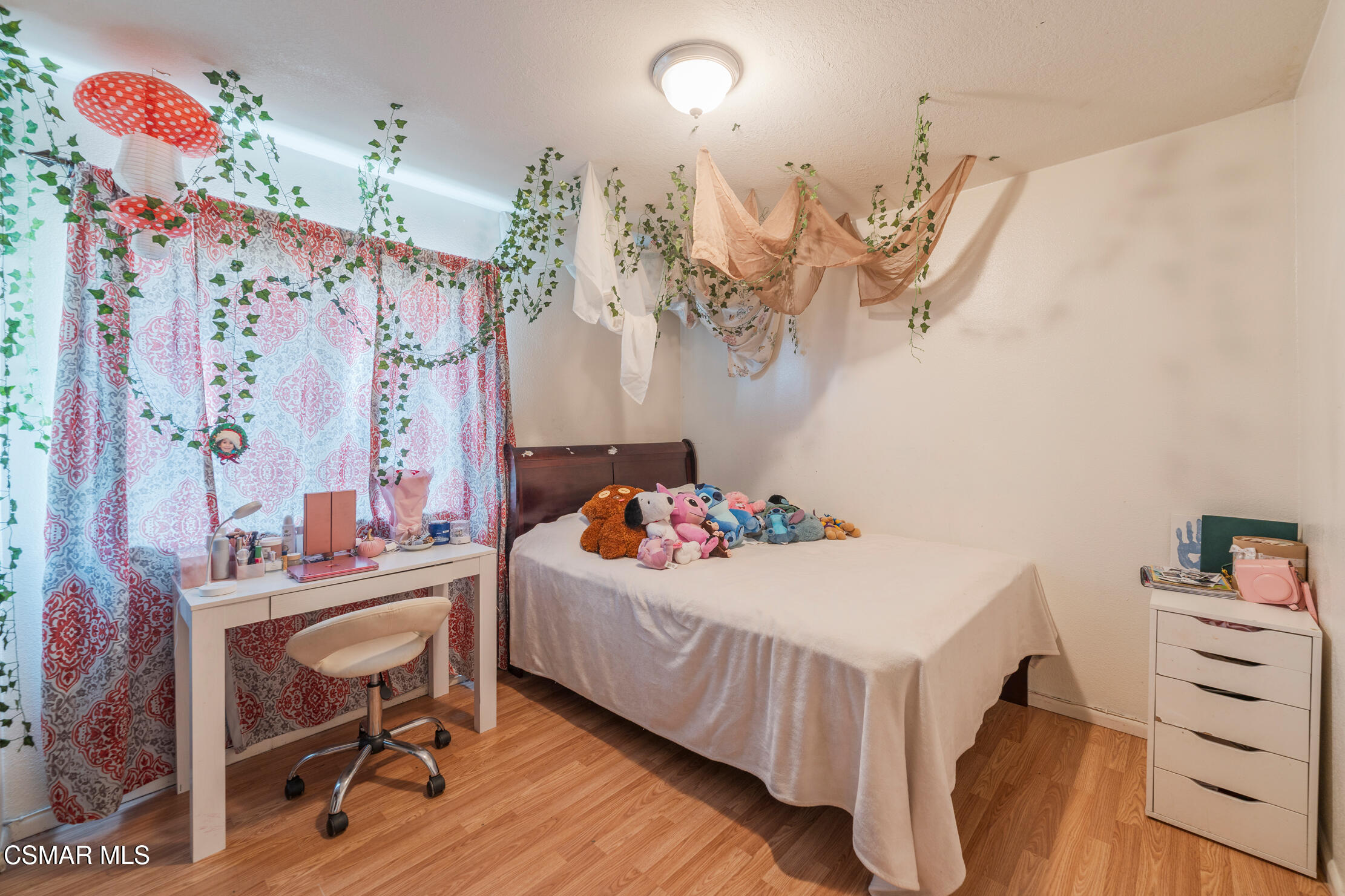 1917 Fitzgerald Road Simi Valley, CA 93065 - Photo 29 of 55 a bedroom with a bed and a table in it