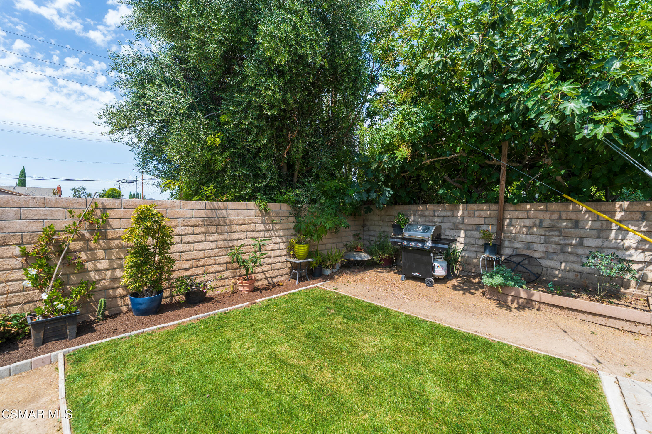 1917 Fitzgerald Road Simi Valley, CA 93065 - Photo 39 of 55 a view of a chair and table in backyard