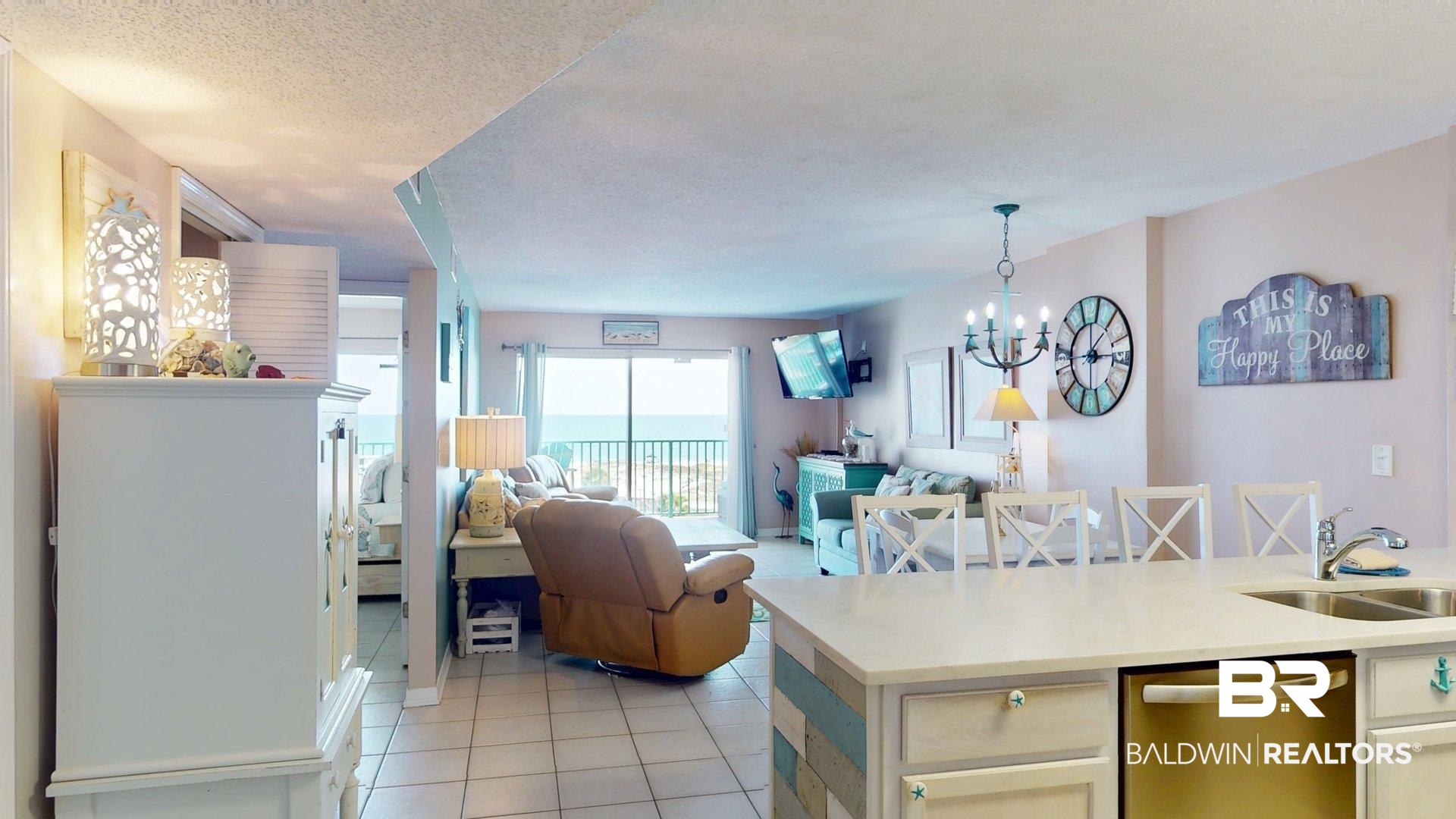 645 Plantation Road, Unit 6503 Gulf Shores, AL 36542 - Photo 53 of 53 Kitchen with stainless steel dishwasher, light tile patterned floors, light stone countertops, a textured ceiling, and open floor plan
