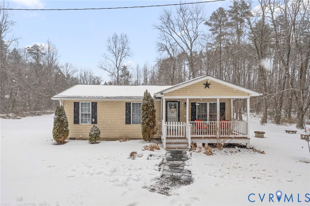 675 Goldmine Road Louisa, VA 23093 - Photo 1 of 29 a front view of a house with a yard covered in snow
