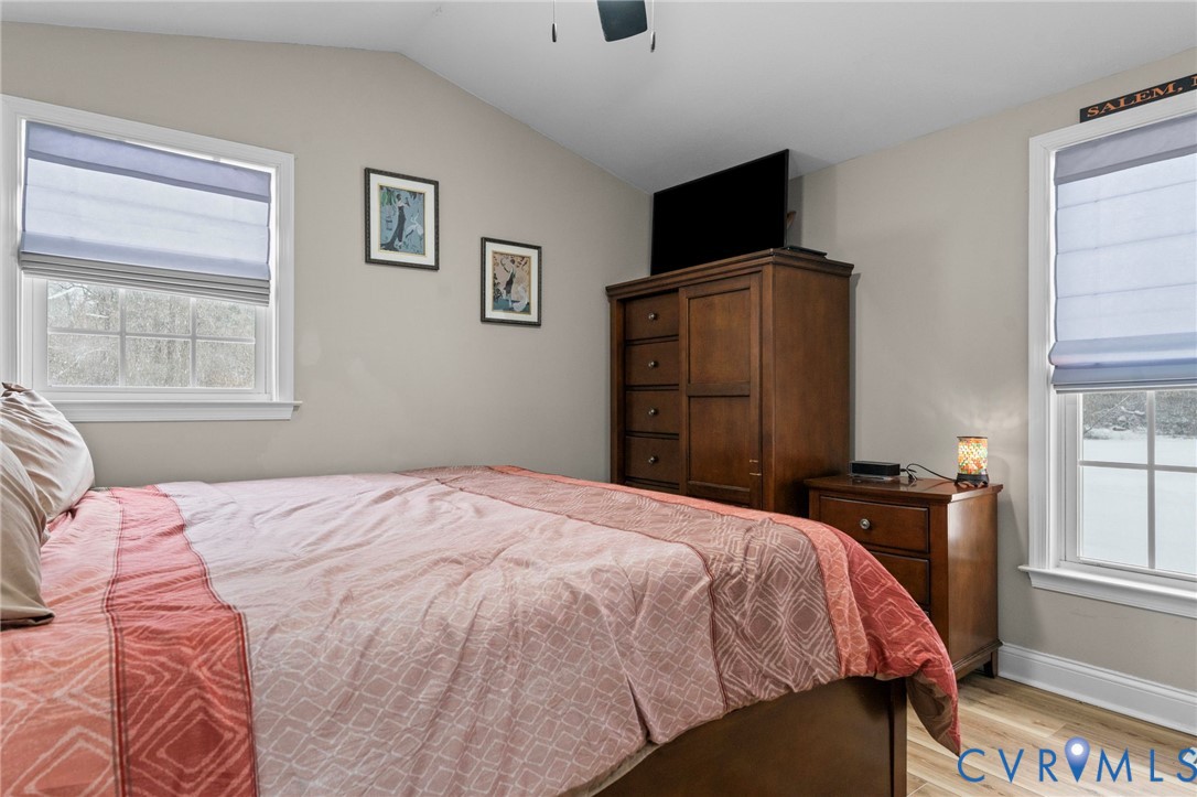 675 Goldmine Road Louisa, VA 23093 - Photo 12 of 29 a bedroom with a bed and wooden floor