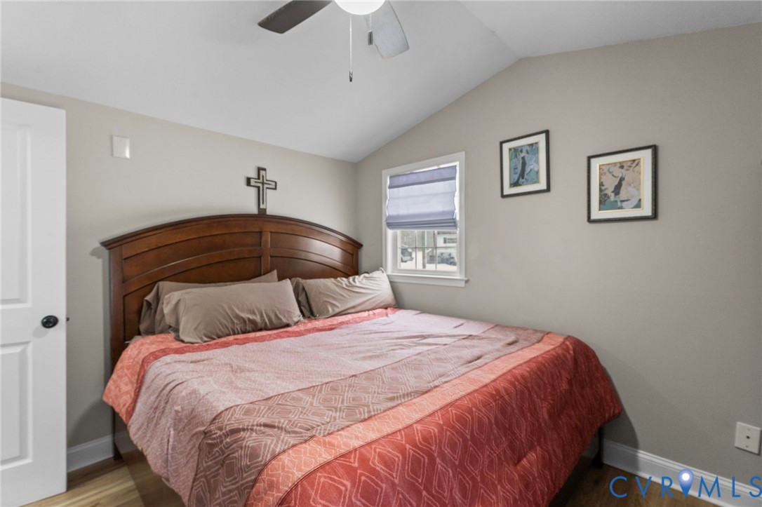 675 Goldmine Road Louisa, VA 23093 - Photo 13 of 29 a bedroom with a bed and a chandelier