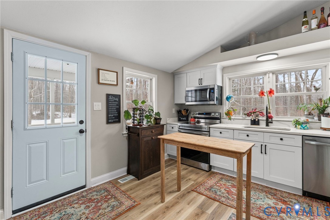 675 Goldmine Road Louisa, VA 23093 - Photo 15 of 29 a kitchen with stainless steel appliances granite countertop a refrigerator and a stove top oven