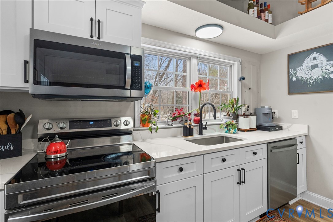 675 Goldmine Road Louisa, VA 23093 - Photo 18 of 29 a kitchen with sink and a microwave