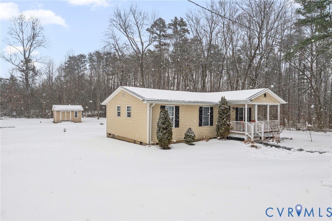 675 Goldmine Road Louisa, VA 23093 - Photo 20 of 29 a view of a house with a bench in front of house