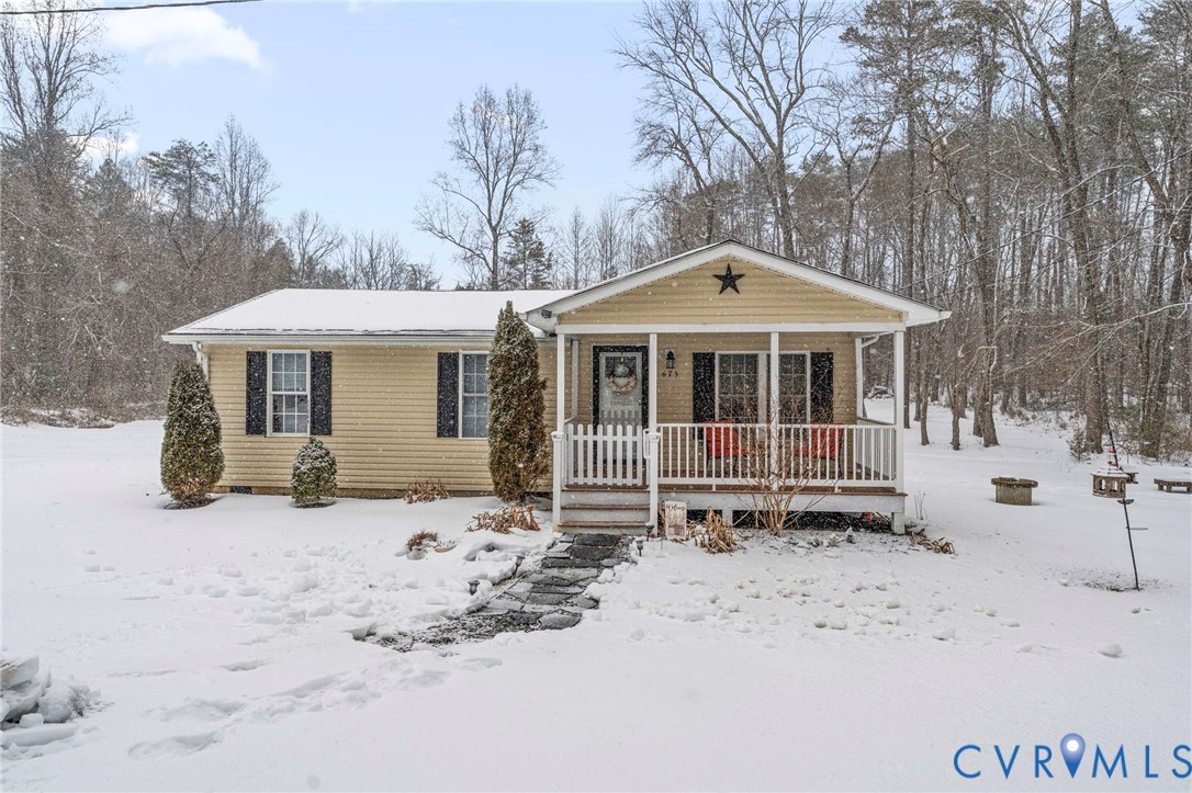 675 Goldmine Road Louisa, VA 23093 - Photo 2 of 29 a front view of a house with a yard covered in snow