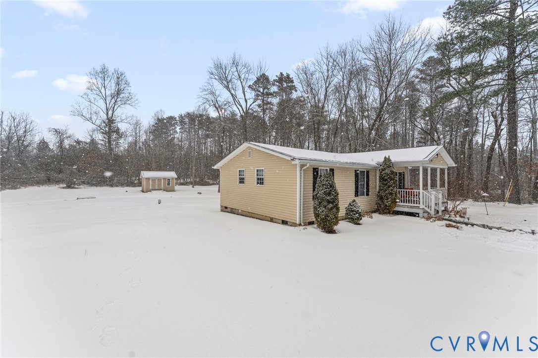 675 Goldmine Road Louisa, VA 23093 - Photo 29 of 29 a view of a house with a yard covered in snow