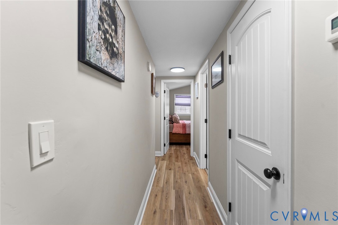 675 Goldmine Road Louisa, VA 23093 - Photo 6 of 29 a view of a hallway with wooden floor and closet