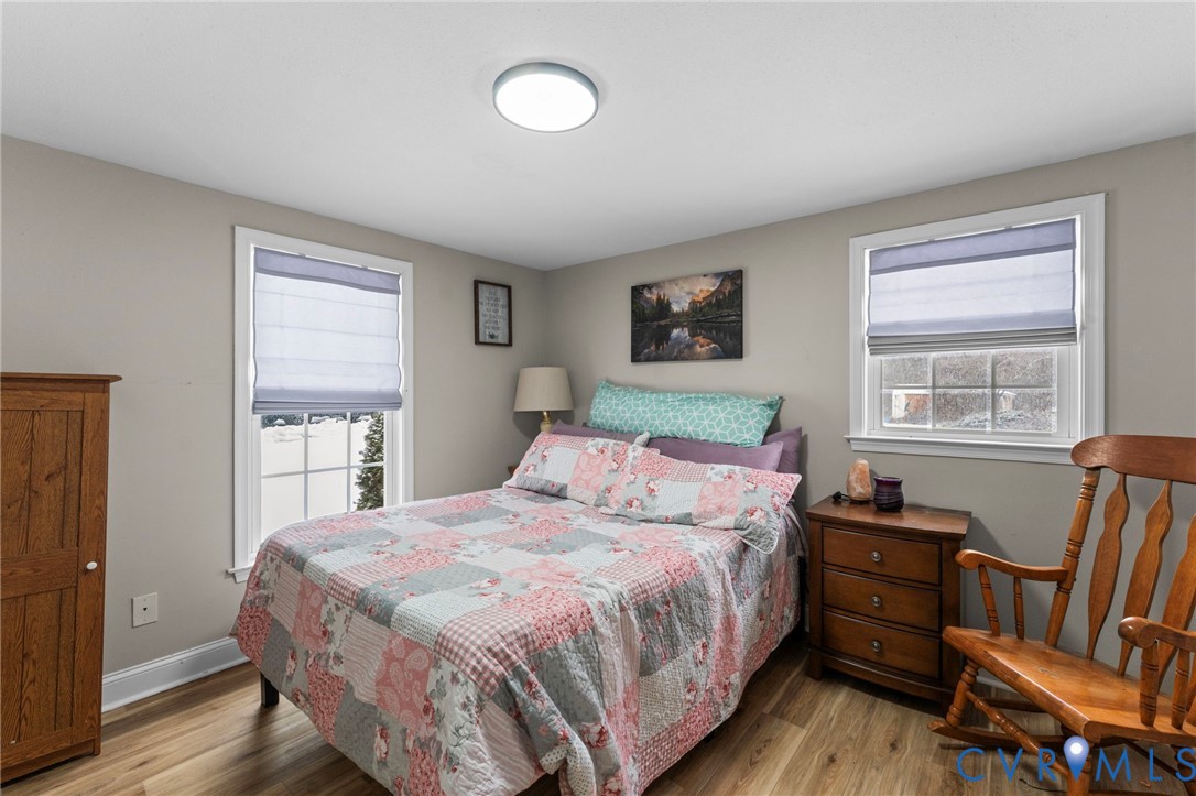 675 Goldmine Road Louisa, VA 23093 - Photo 9 of 29 a bedroom with a bed and wooden floor