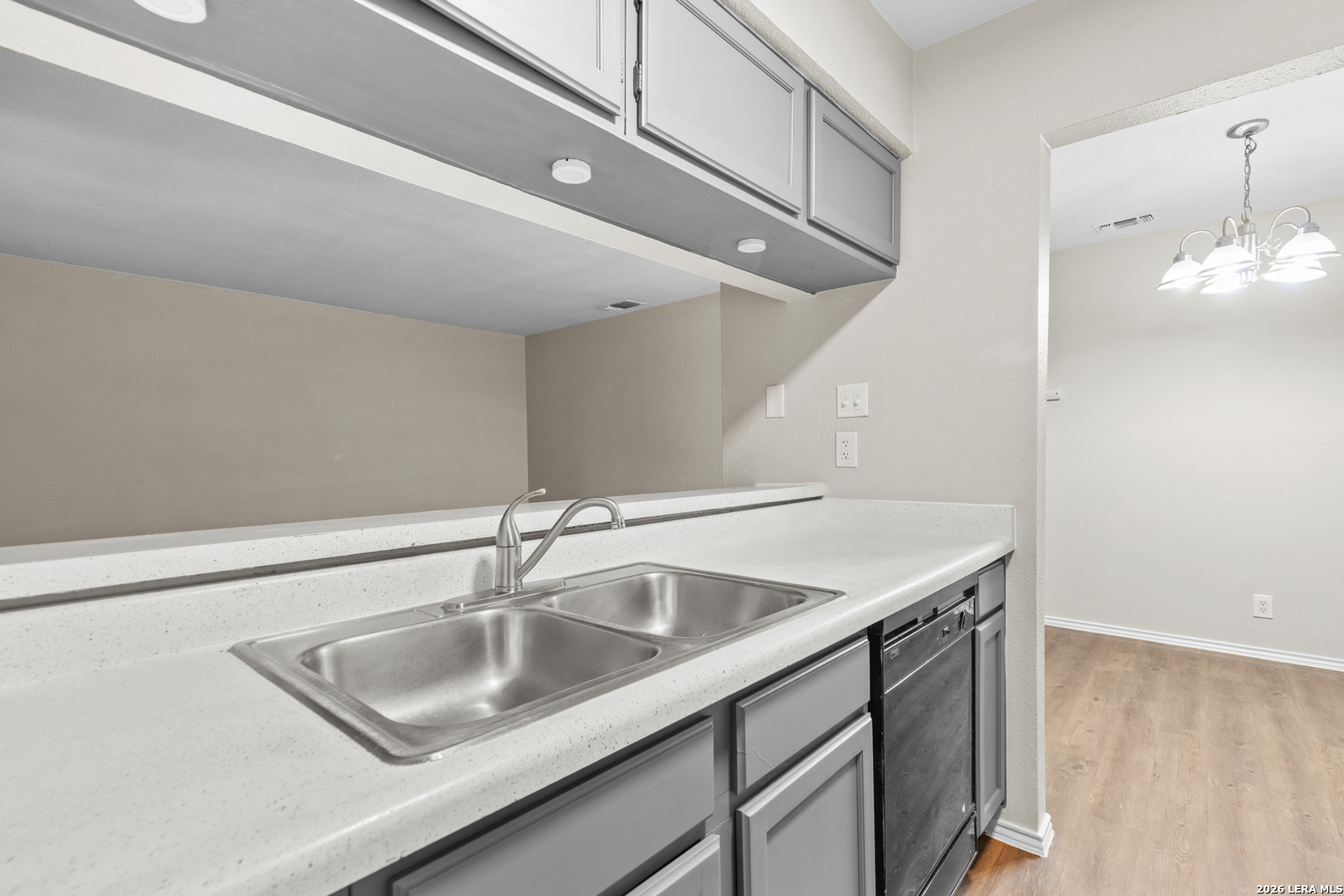 5230 Meadow Rise Street San Antonio, TX 78250 - Photo 19 of 30 a bathroom with a sink and a mirror