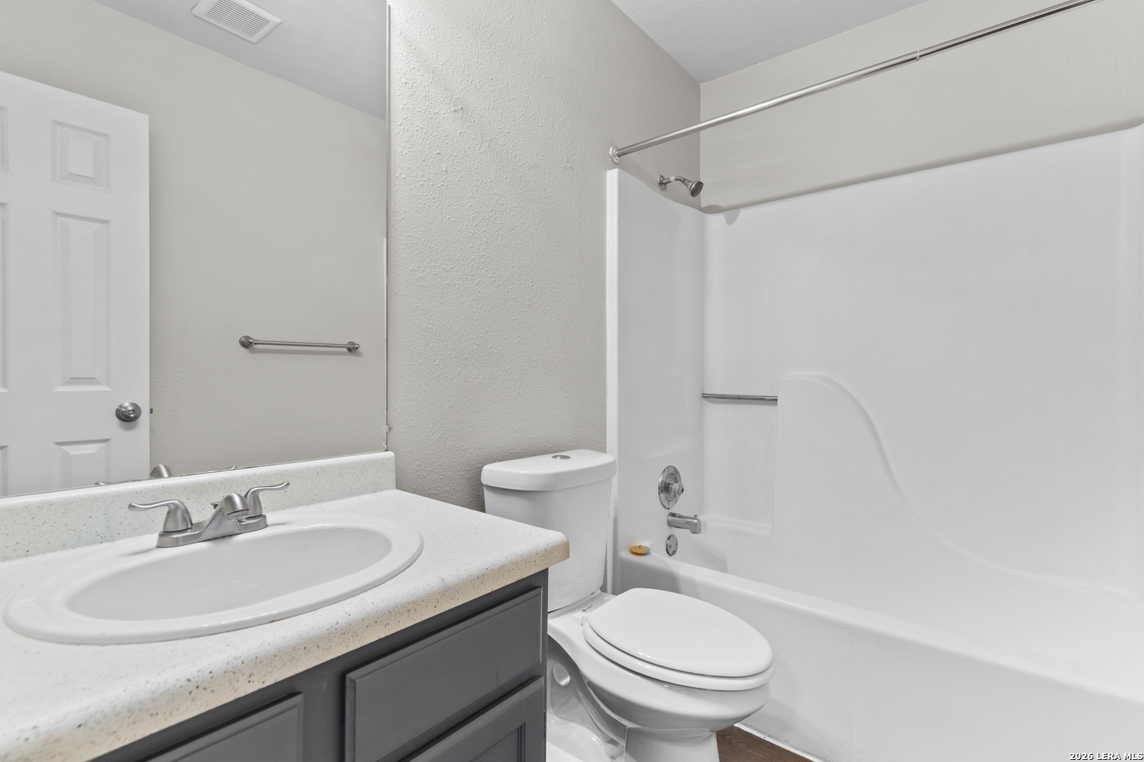 5230 Meadow Rise Street San Antonio, TX 78250 - Photo 23 of 30 a bathroom with a sink toilet vanity and shower