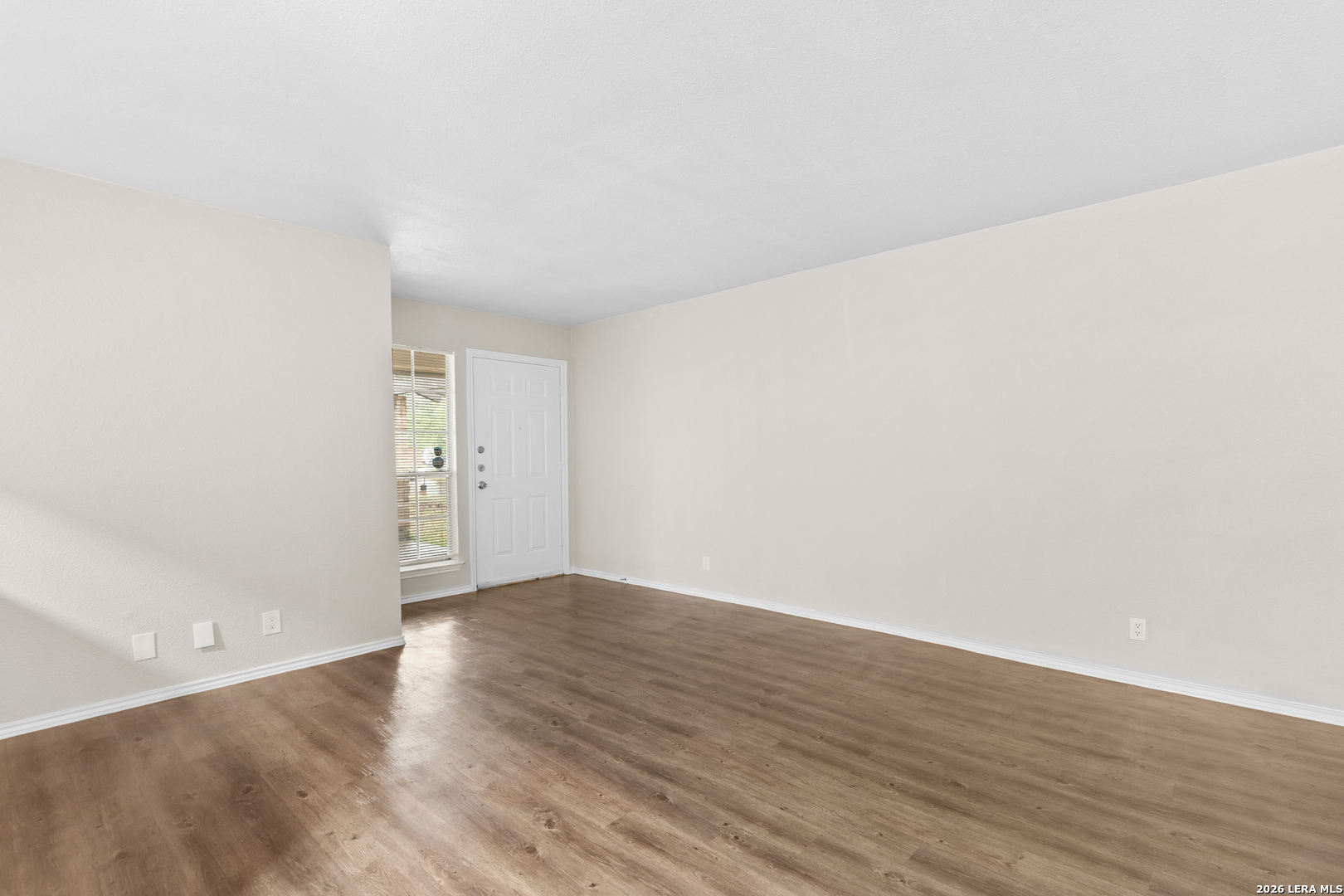 5230 Meadow Rise Street San Antonio, TX 78250 - Photo 27 of 30 a view of an empty room and wooden floor