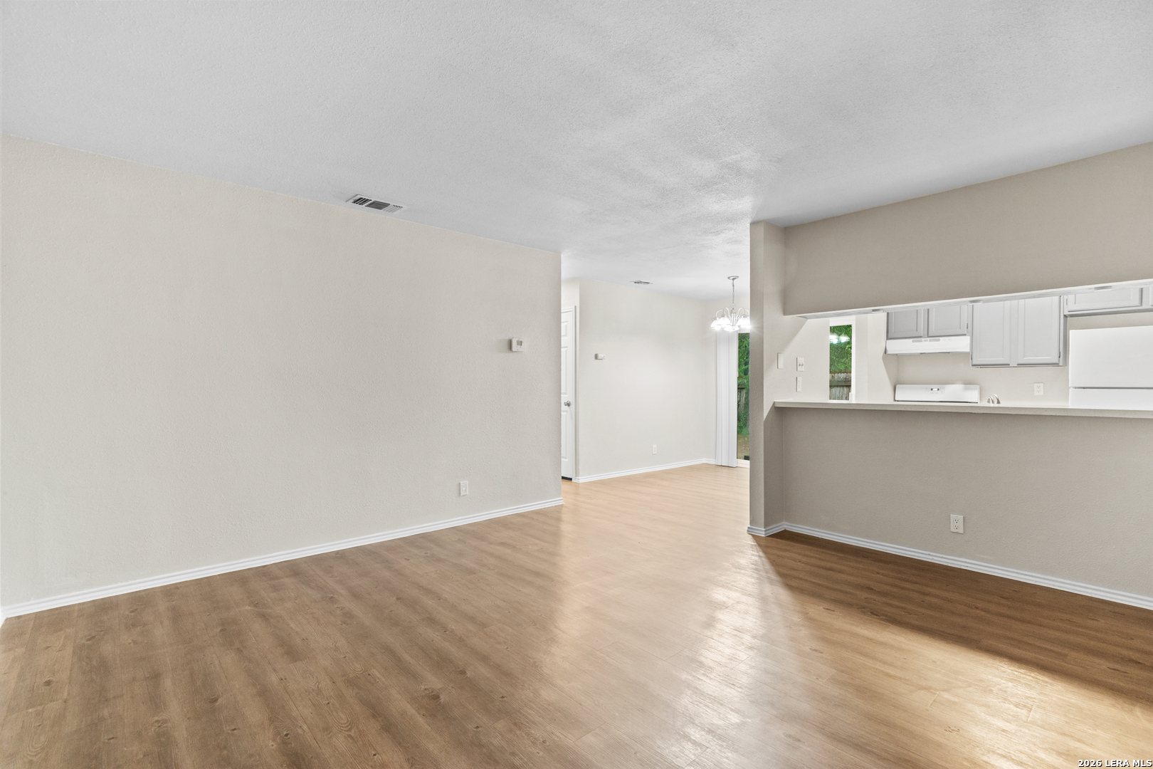 5230 Meadow Rise Street San Antonio, TX 78250 - Photo 28 of 30 a view of kitchen with wooden floor