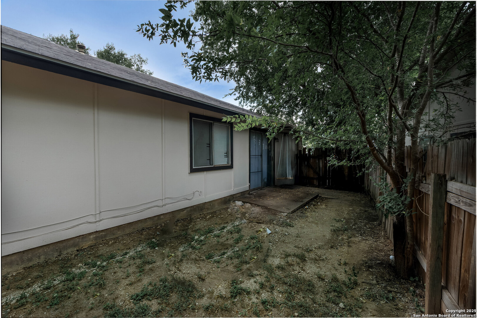 5230 Meadow Rise Street San Antonio, TX 78250 - Photo 5 of 30 a backyard of a house with lots of green space