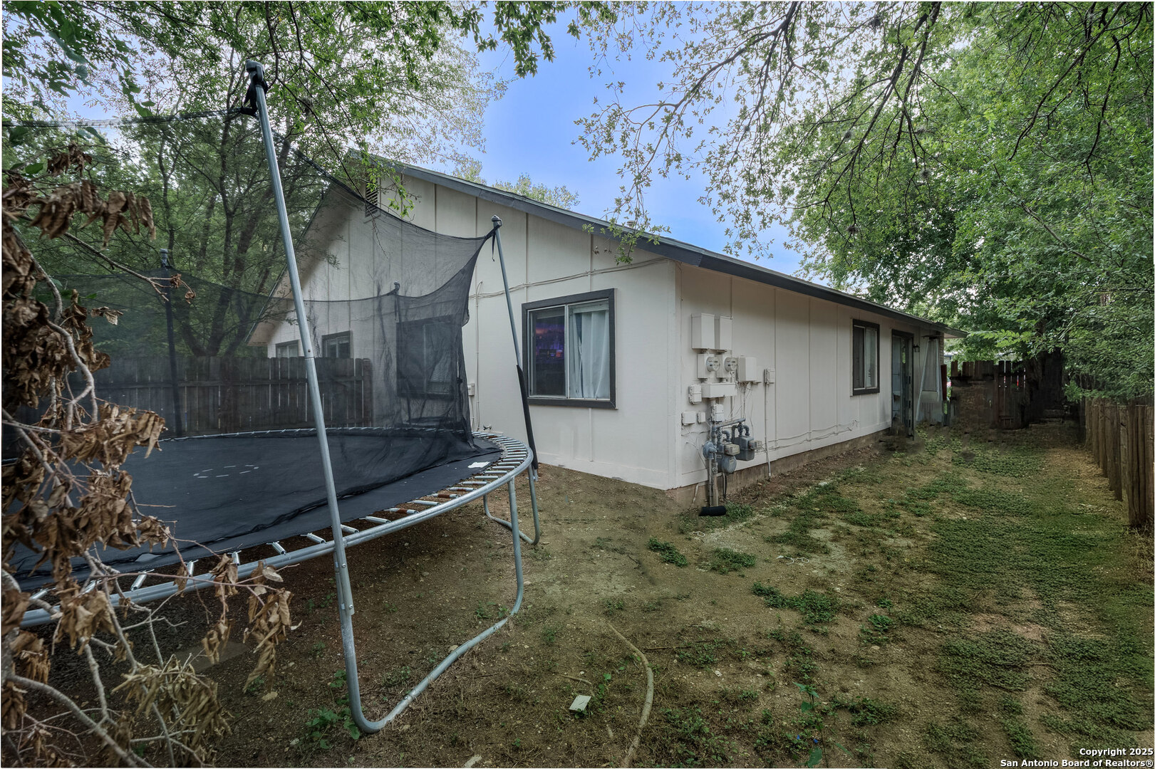 5230 Meadow Rise Street San Antonio, TX 78250 - Photo 7 of 30 a backyard of a house with lots of green space