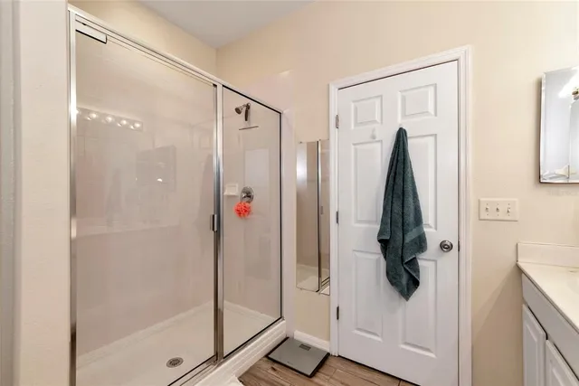 a bathroom with a double vanity sink and a mirror