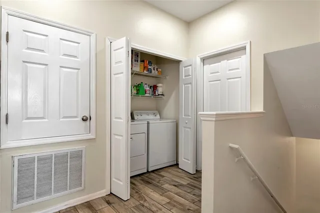 a kitchen with a refrigerator stove and microwave