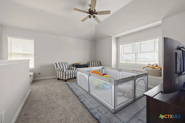 a bedroom with furniture and a window