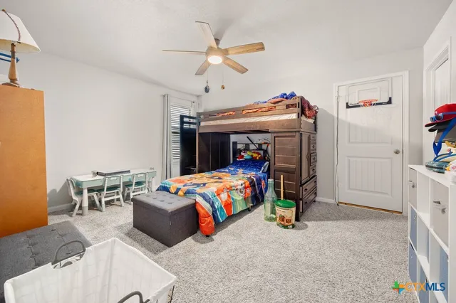 a bedroom with a bed and a table