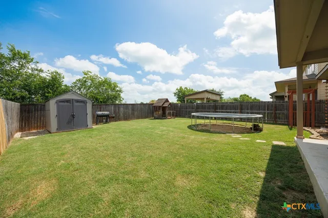a swimming pool with wooden fence