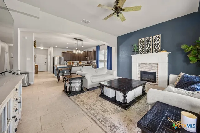a living room with furniture and a fireplace