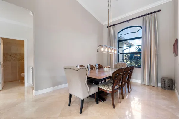 a view of a dining room with furniture and window