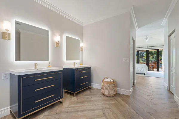 a bathroom with a sink a tub and a mirror