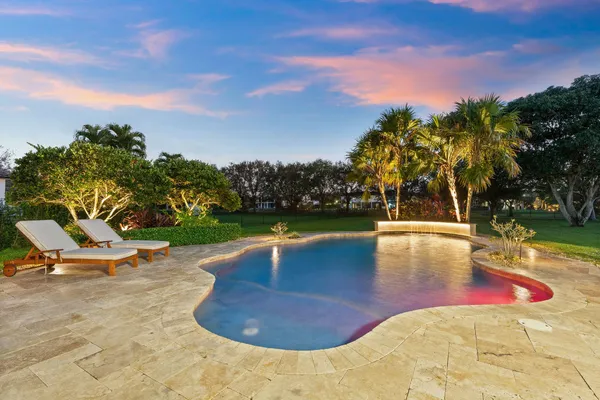 a view of outdoor space with swimming pool and furniture