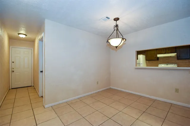 a view of a room with rack and wooden floor